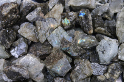 Close up picture of rough labradorite stones that are approximately 1-2 inches in size.