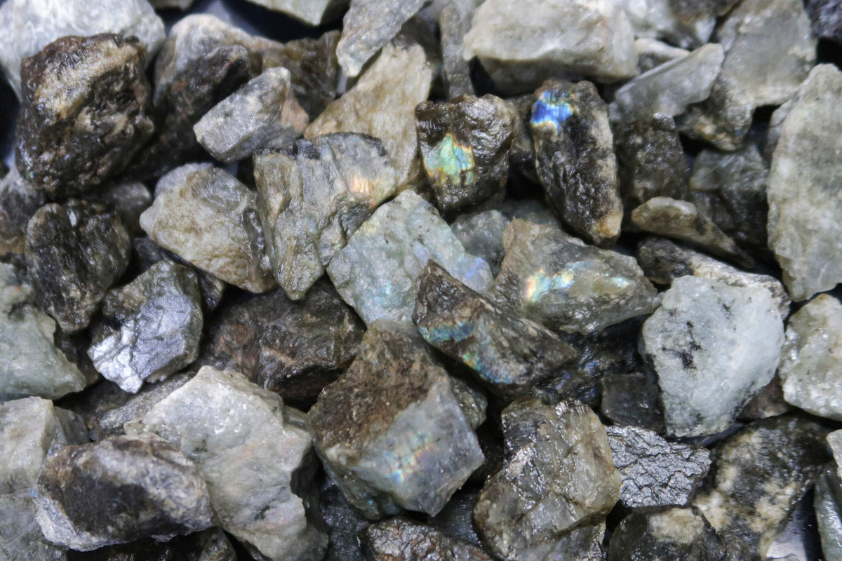 Close up picture of rough labradorite stones that are approximately 1-2 inches in size.