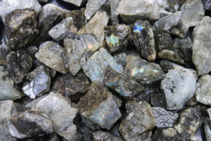 Close up picture of rough labradorite stones that are approximately 1-2 inches in size.