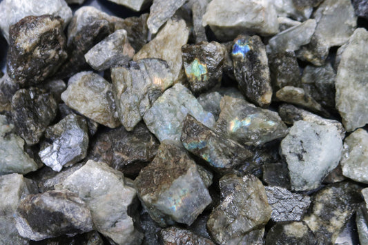 Close up picture of rough labradorite stones that are approximately 1-2 inches in size.